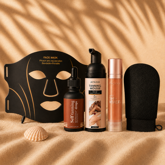 Sundipt Everything Kit — all five products: LED Glow Mask, Self-Tan Drops, Tanning Mousse, Glow Oil and Tan Prep Mitt on sun-warmed sand